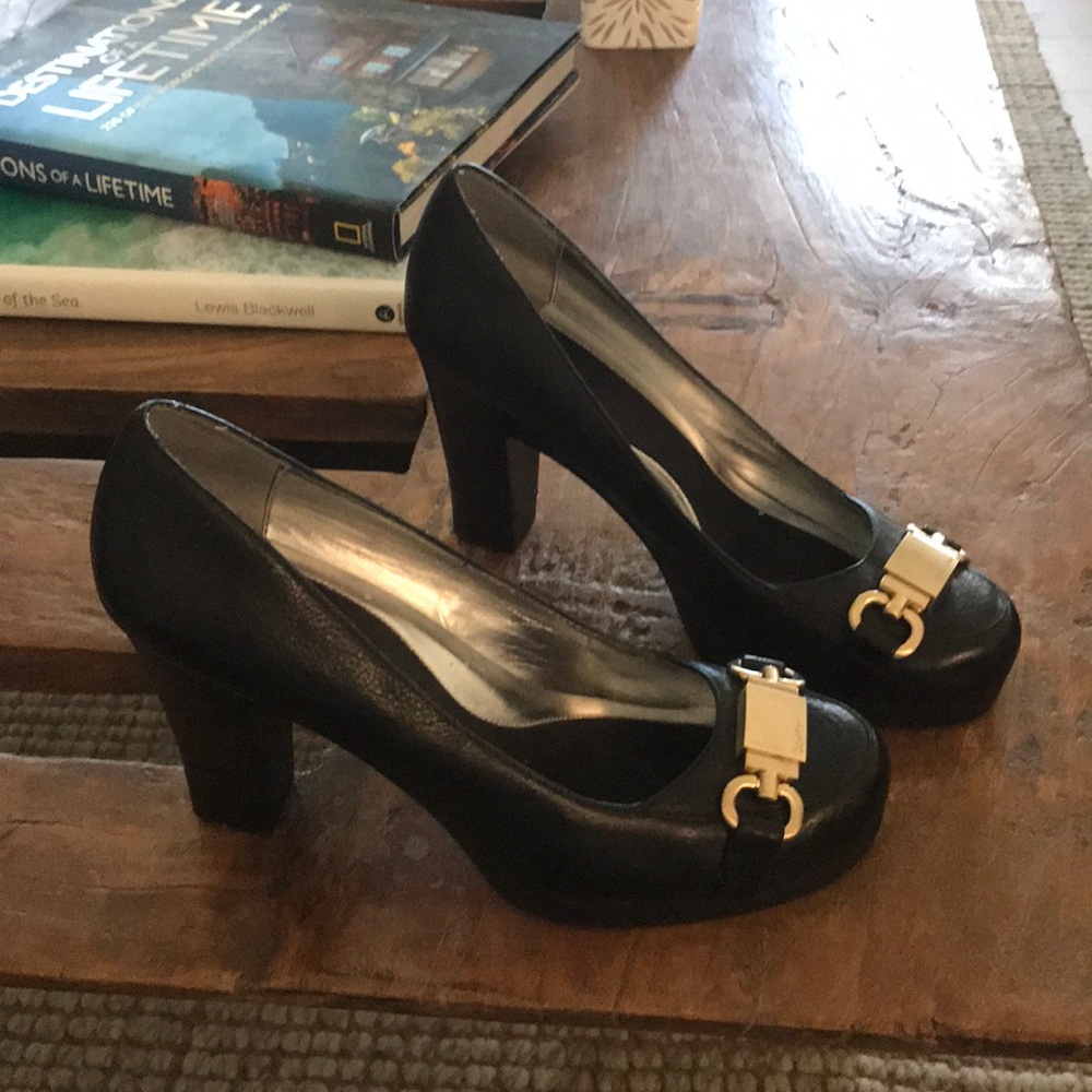 Calvin Klein 3 3/4 black heels with gold buckle.
